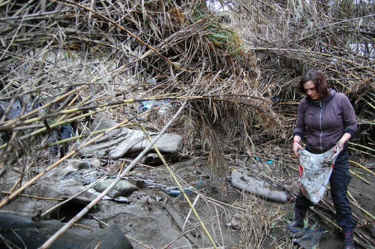 Homless community cleans riverside