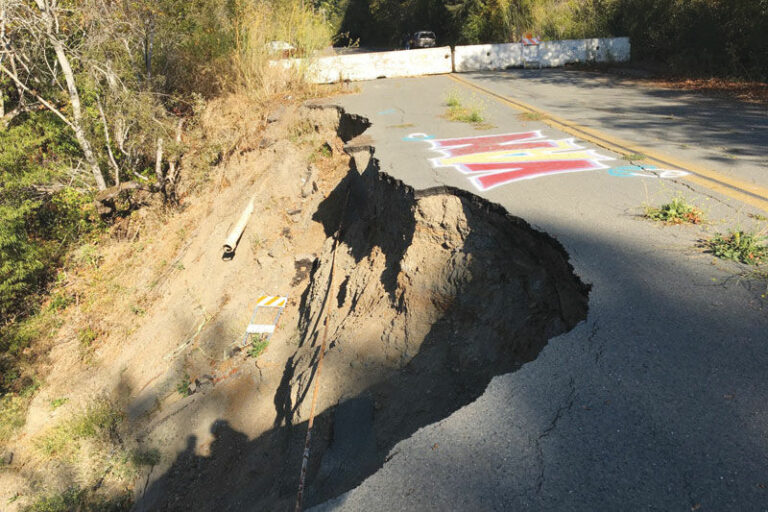 River area ponders washed-out roads and escape routes