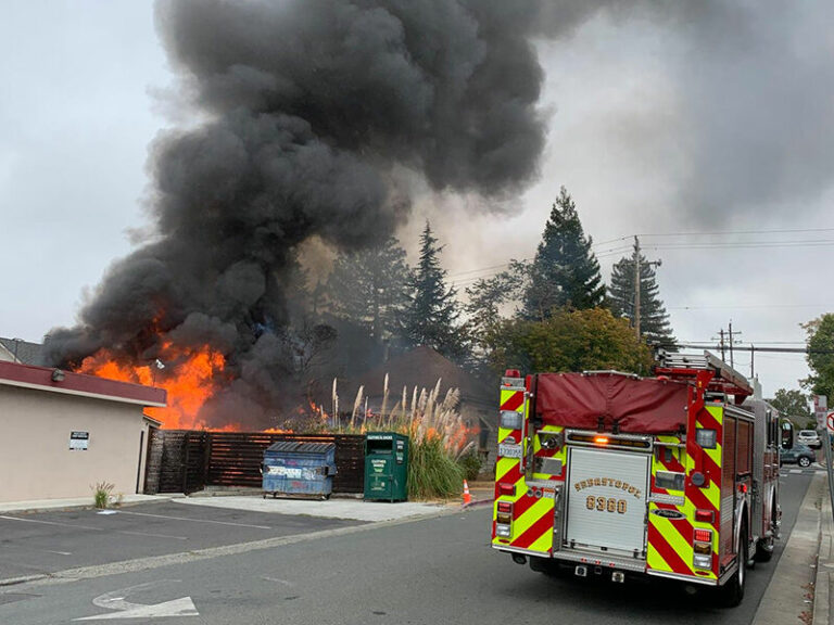 Fire destroys outbuilding and damages vacant home south of downtown