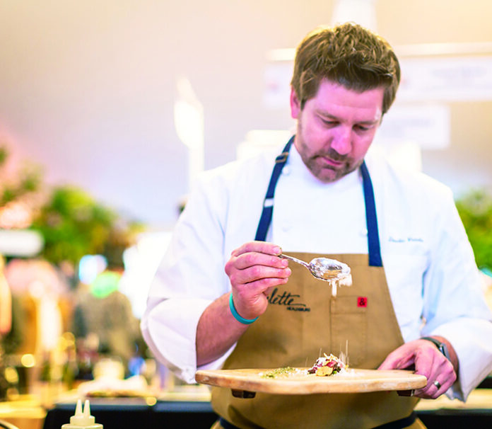 Chef Dustin Valette prepares a dish