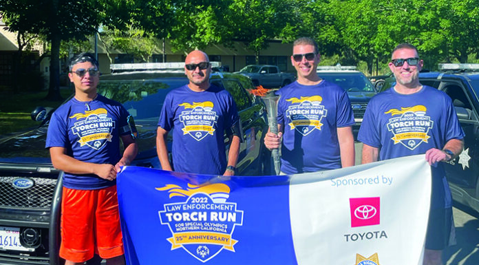 Members of the Healdsburg Police Department who participated in the June 2022 Law Enforcement Torch Run for Special Olympics. From left, Angel Rodriguez, Lt. Luis Rodriguez, Chief Matt Jenkins with torch, and Officer Nick Doherty.