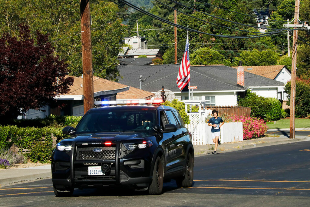 Police escort for lead running in 2023 Fitch Mountain Footrace