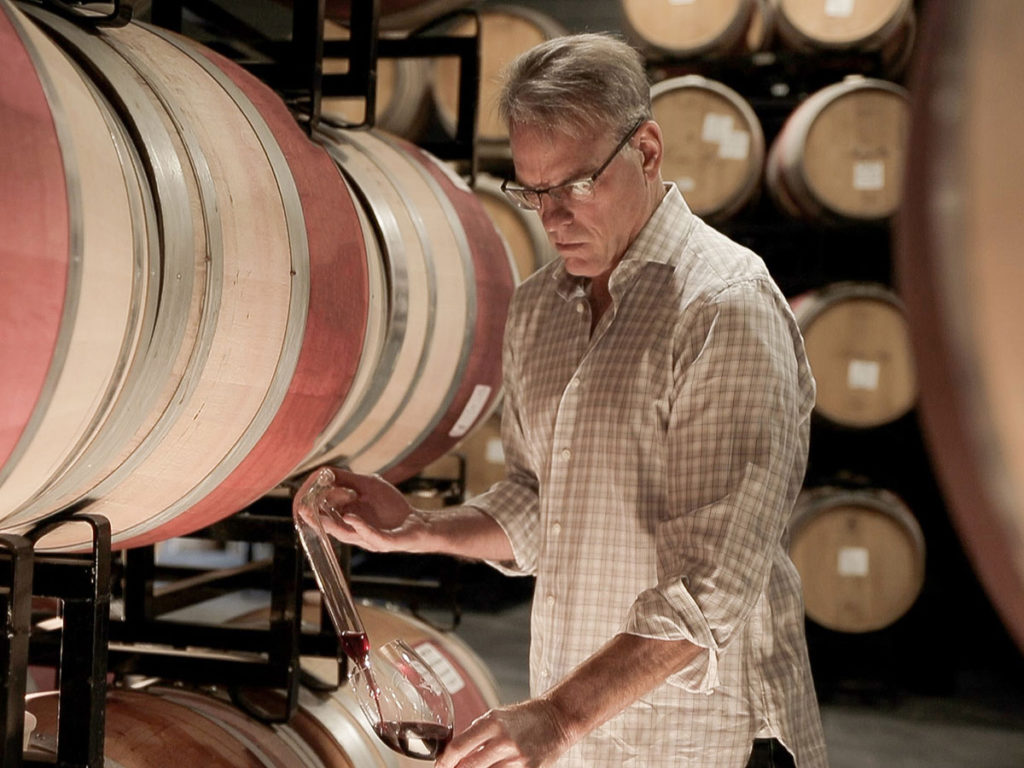 Man in barrel room