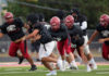 Football action in scrimmage