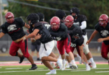 Football action in scrimmage