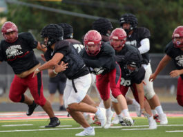 Football action in scrimmage