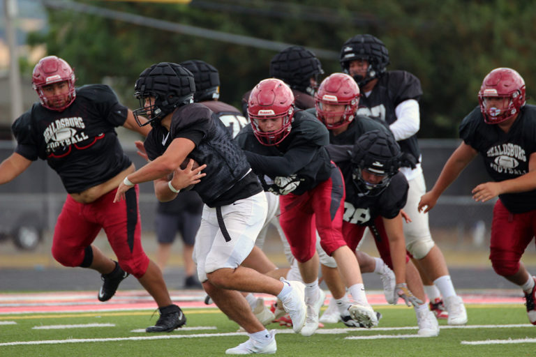 Football action in scrimmage