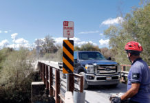 Bike and truck at bridge