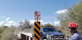 Bike and truck at bridge