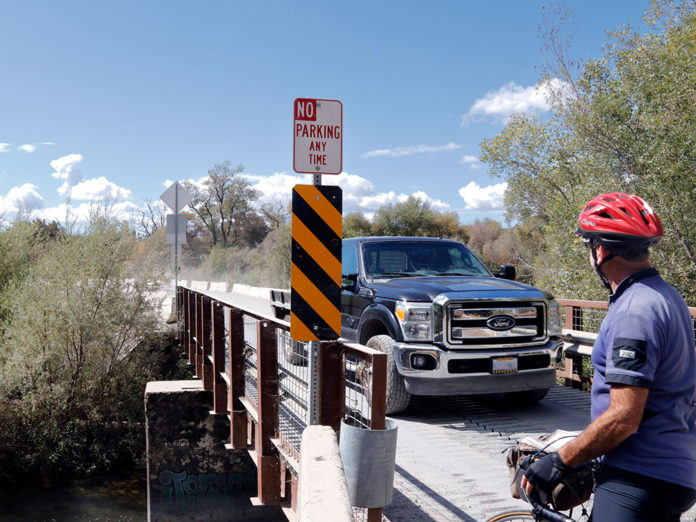 Bike and truck at bridge