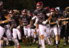 Football team running onto field