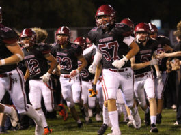 Football team running onto field