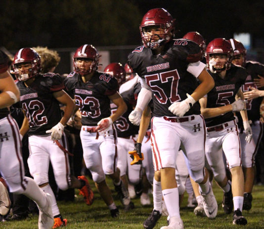 Football team running onto field