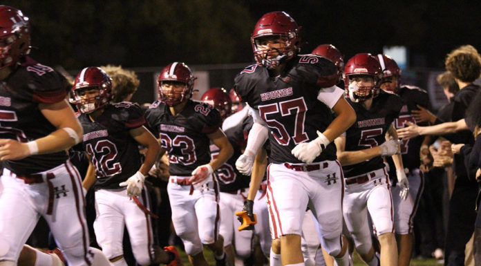 Football team running onto field