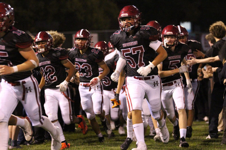 Football team running onto field