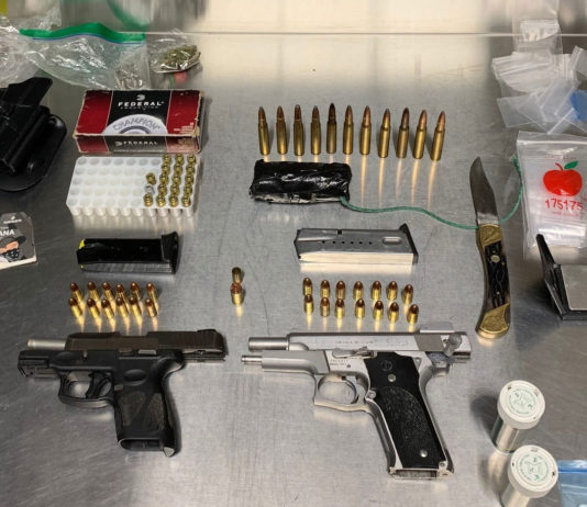 Arrest evidence of guns, ammo, drugs