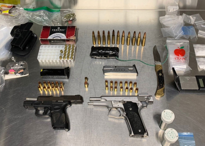 Arrest evidence of guns, ammo, drugs