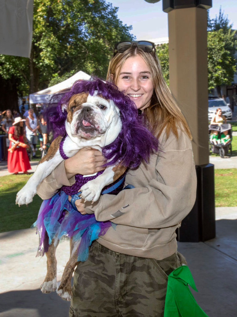 Dog in wig plus owner