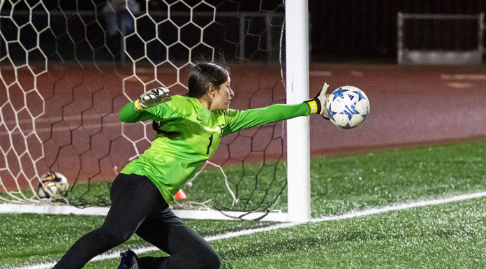 Kimberly Lopez makes a block