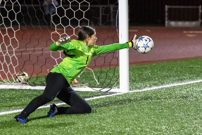 Kimberly Lopez makes a block