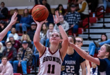 Claire Berry shooting a basket