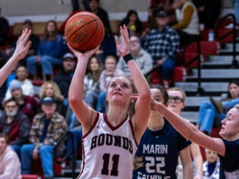 Claire Berry shooting a basket