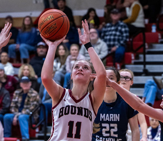 Claire Berry shooting a basket