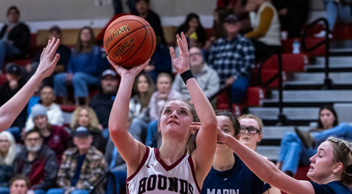 Claire Berry shooting a basket