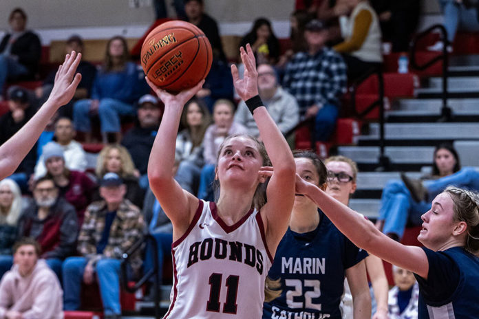 Claire Berry shooting a basket