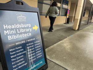 Library directional sign with hours