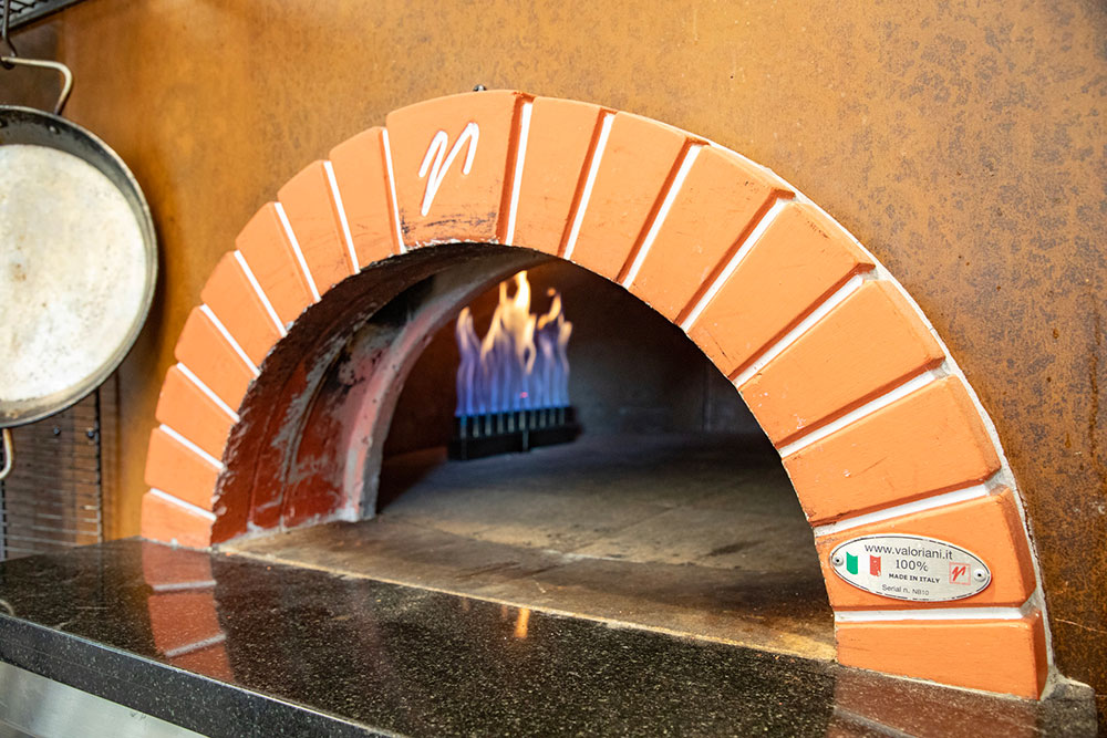 Gas element in wood-fire oven