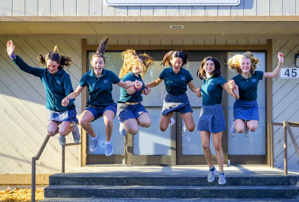 Jumping school girls